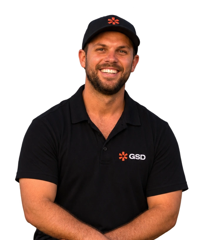 Darcey Collins smiling in a black GSD WA polo shirt