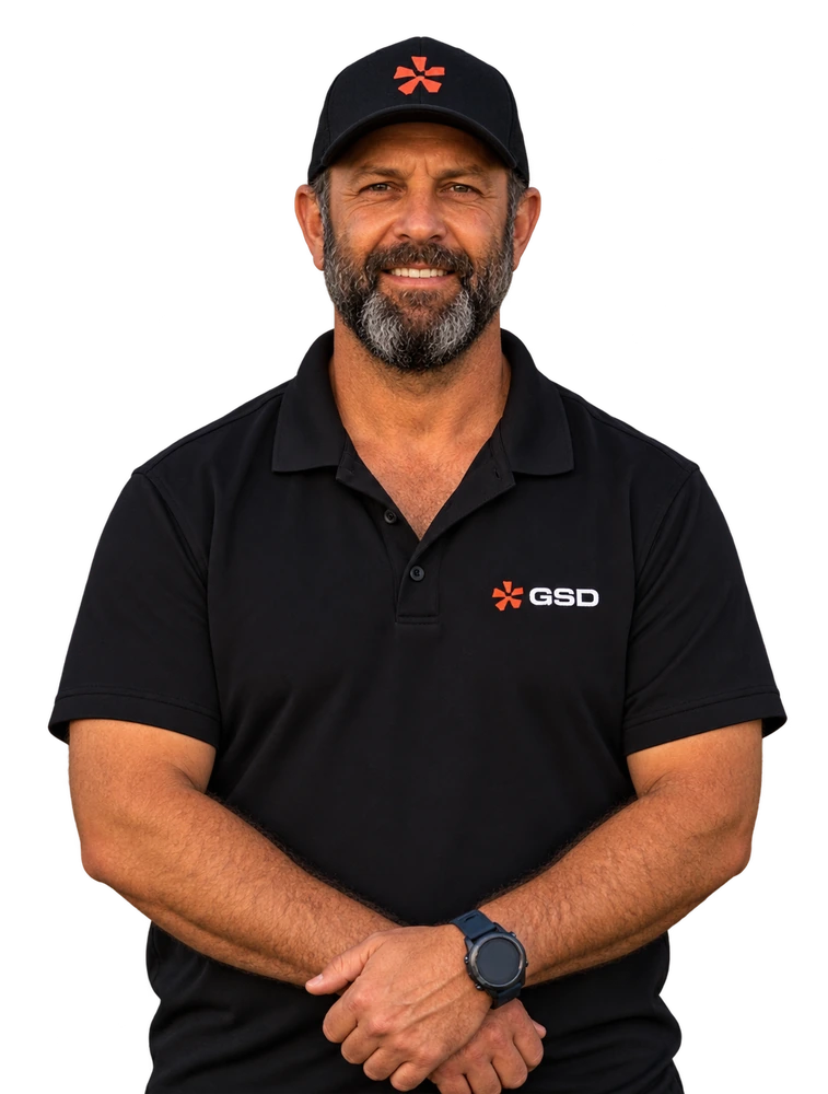 Scott Collins smiling in a black GSD WA polo shirt